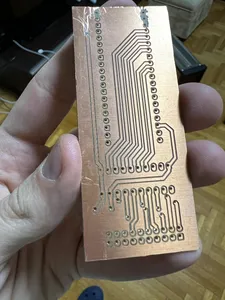 The PCB as it came out of the CNC and our scuffed post processing (bottom)